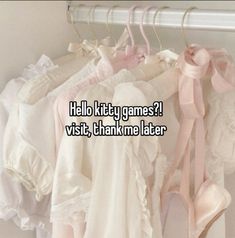 clothes hanging on a rail with the words hello kitty games visit, thank me later