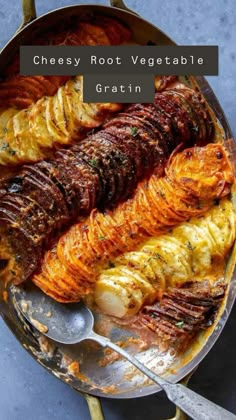 an iron skillet filled with meat and potatoes on top of a blue countertop