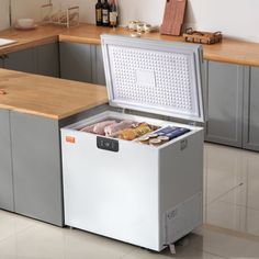 an ice chest in the middle of a kitchen