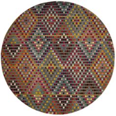 a round rug with multicolored dots on it and a circular design in the middle