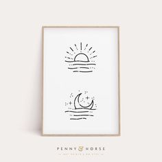 a black and white print with the sun and moon on it in a wooden frame