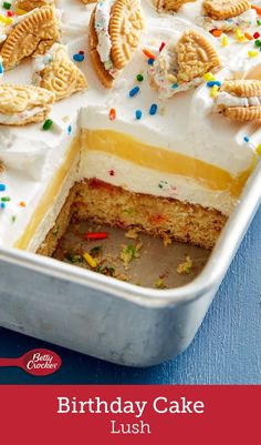 a birthday cake with white frosting and colorful sprinkles in a pan