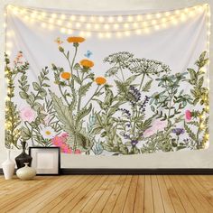 an image of a wall with flowers and butterflies on it in a room that is decorated with string lights