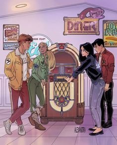 three people are standing in front of a jukebox with the words diner on it