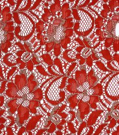 a red lace with hearts on it is seen in this close up image, taken from above