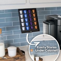 a coffee maker sitting on top of a counter next to a cup holder with cups in it