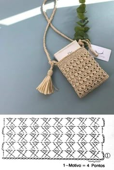 a crocheted bag with a tassel hanging from it's side, next to a plant