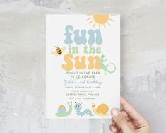 a person holding up a card with the words fun in the sun written on it