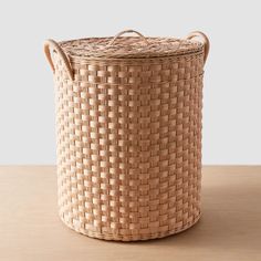 a woven basket on a wooden table