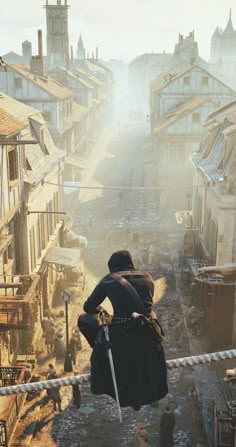 a man standing on top of a building next to a street filled with buildings and people