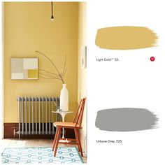 a room with yellow and gray paint on the walls next to a radiator