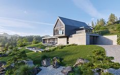 a house on top of a hill surrounded by trees and grass with rocks in the foreground