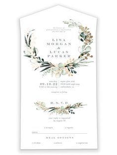 an elegant wedding card with greenery and flowers on the front, in white paper