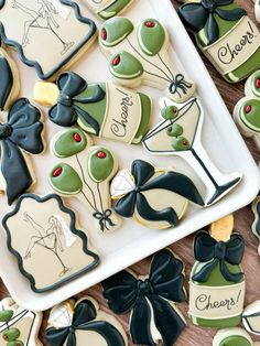 decorated cookies are arranged on a platter