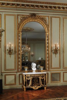 an ornately decorated room with gold trimming