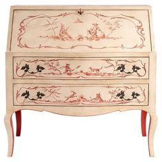 an old dresser with red and white designs on it