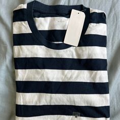 Uniqlo Striped Tee Shirt Medium Nwt $29.50 Everyday Striped Cotton Tops, Navy Cotton Shirt For Everyday, Navy Cotton T-shirt For Spring, Casual Striped Crew Neck Shirt, Uniqlo Cotton Long Sleeve Tops, Uniqlo Long Sleeve Cotton Shirt, Uniqlo Long Sleeve Cotton Top, Spring Navy Crew Neck Shirt, Navy Crew Neck Shirt For Spring