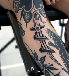 a person with a tattoo on their leg