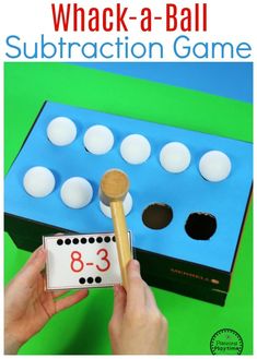 a hand holding a hammer over a game board with numbers on it and the number 8 - 3