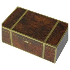 a large wooden box with gold trimmings