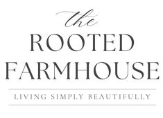 the rooted farmhouse logo with black and white lettering on it's bottom corner