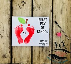 the first day of school book is displayed on a wooden table with scissors and eyeliners