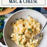 a bowl filled with macaroni and cheese on top of a table