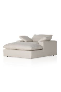 a white couch with pillows on it