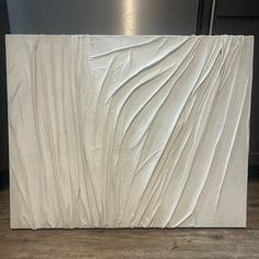 a white marble slab with wavy lines on it