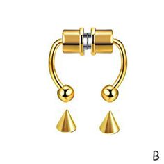 an image of two gold nose rings with bells on each side and one in the middle