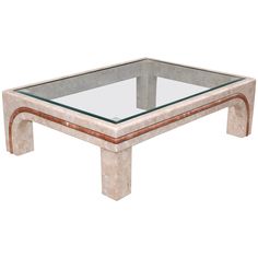 a marble and glass coffee table with an intricate design on the top, viewed from the side