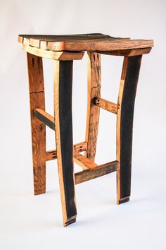 a wooden stool made out of wood and metal