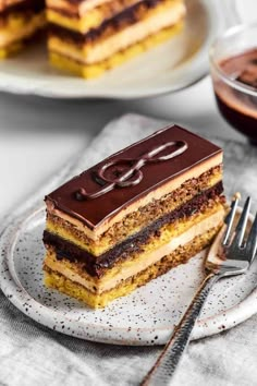 a piece of cake sitting on top of a plate next to a knife and fork