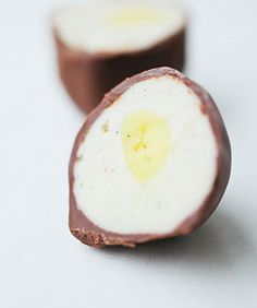 two pieces of chocolate sitting next to each other on top of a white countertop