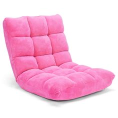 a pink futon chair sitting on top of a white floor