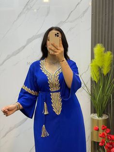 Royal blue kaftan with belt Royal blue kaftan embroidered in gold and handbeaded. Simple, elegant blue and gold caftan with a lovely fabric belt to tie around the waist. standard size from M to 2XL  Measures : **Chest circumference : 61 cm// 26.01  inch **Waist circumference : 88 cm//  24.64 inch **Length                          :142 cm//  55.90 inch **sleeve length               : 44 cm// 17.32 inch This pretty blue Kaftan is made from a silky crepe fabric that's pleasant to wear  This pretty Blue Evening Abaya For Eid, Festive Blue Abaya For Party, Festive Blue Party Abaya, Blue Long Sleeve Thobe For Party, Floor-length Blue Abaya For Party, Blue Floor-length Abaya For Party, Blue Maxi Length Evening Abaya, Blue V-neck Kaftan For Party, Blue Dabka Maxi Length Abaya