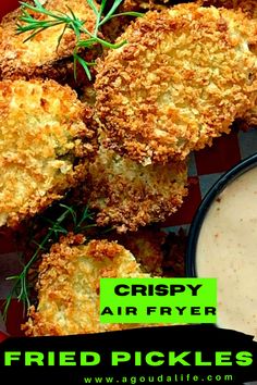 crispy air fryer fried pickles with ranch dip in the middle on a red and white checkered plate