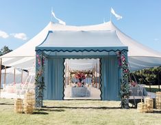 a large tent set up for an outdoor wedding