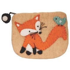 a close up of a small bag with a fox and bird on it