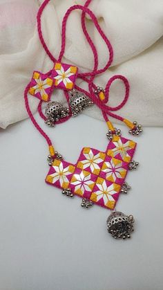 Let's mix 2 designs and taa...daaa....🥳🥳 Our 2 very beloved designs of mirror necklace is mixed ..1 ka pattern and 2 ka mirror work...and… | Instagram Navaratri Handmade Jewelry, Febric Jwellary, Navratri Set, Diy Earrings Materials, Mirror Necklace, Flower Jewelry Designs, Earrings Diy Handmade, Thread Bangles Design, Diy Fabric Jewellery