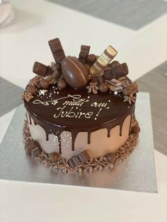 a cake with chocolate icing and candies on top