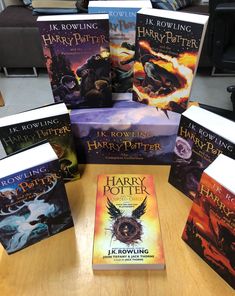 several harry potter books sitting on top of a table