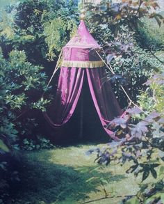 there is a pink tent in the bushes