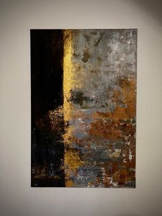 an abstract painting hangs on the wall