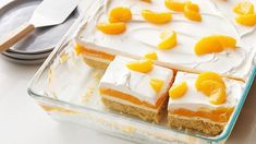 there are orange slices on top of the cake in the glass baking dish, ready to be eaten