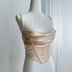 Brand New! Excellent Condition! - Size Us 2 - Beige Color - Very Flattering With Cinch Waist Corset And Draped Bustier - Beautiful Crystal Straps That Are Adjustable - Clasp In The Back Along With Zipper - Very Well Made And Constructed - Perfect For Birthdays Or A Night Out! Sleeveless Satin Corset With Built-in Bra, Cream Corset Top, Elegant Crop Top With Built-in Bra, Corset Bodice Pattern, Fitted Corset Back Camisole Crop Top, Fitted Camisole Crop Top With Corset Back, Elegant Fitted Camisole Corset, Strapless Camisole With Corset Back For Party, Fitted Camisole Corset With Built-in Bra