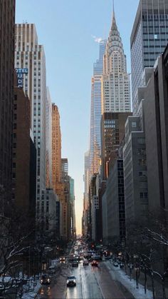 a city street filled with lots of tall buildings