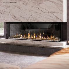 a modern fireplace in a living room with marble walls