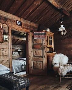 a bedroom with wooden walls and flooring