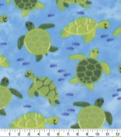 a blue and green sea turtle fabric with small turtles on the bottom, in front of a